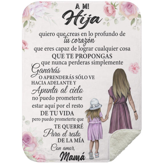 Soft blanket with "Creas En Lo Mas Profundo De Tu Corazon" heartfelt message and black sherpa back