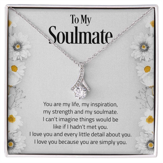 Alluring Beauty necklace with petite ribbon pendant and cubic zirconia in gold finish