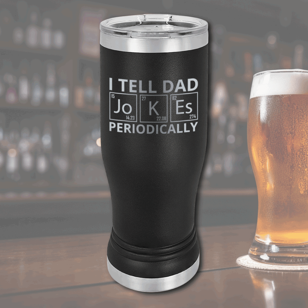 Black stainless steel pilsner tumbler with "I tell dad jokes periodically" text in periodic table style at bar setting